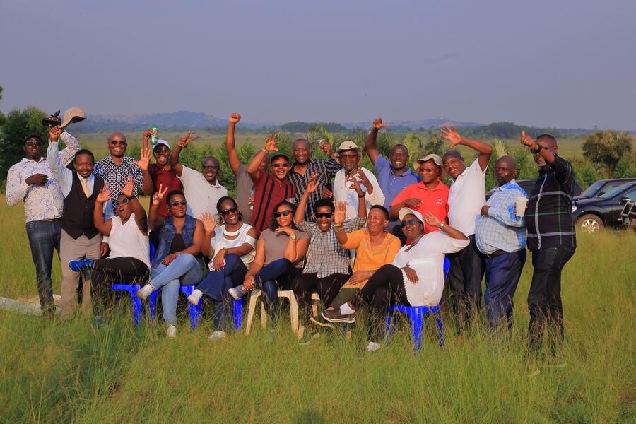 Ruhaama members standing together on estate land